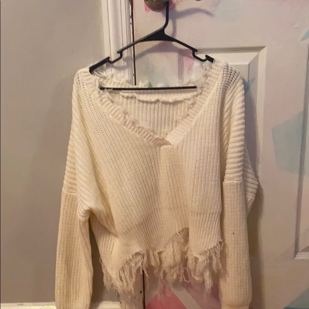 White shredded sweater